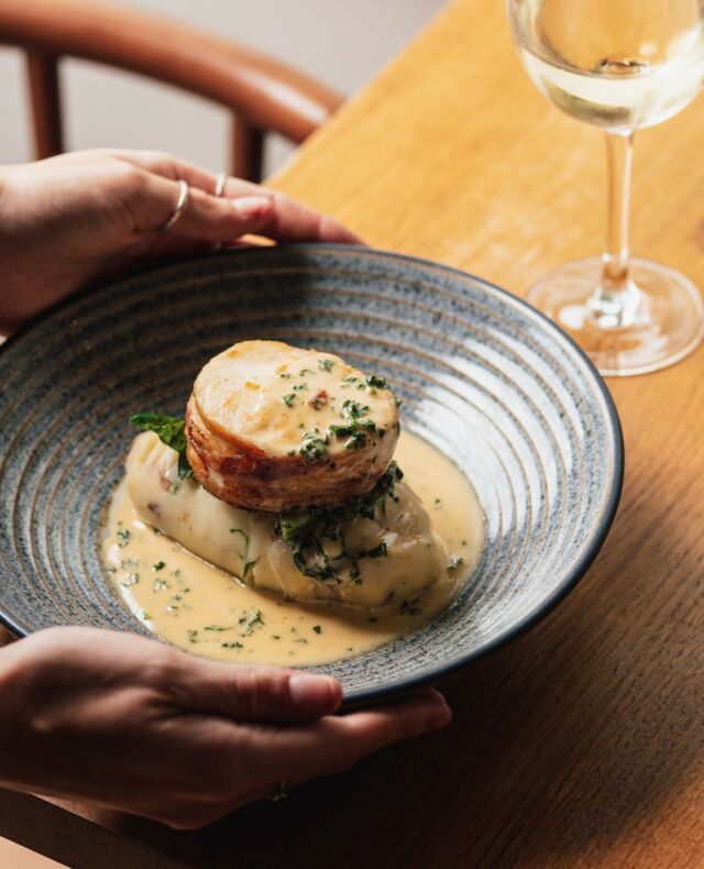 A star of our new menu, the Hake dish: Hake with a ham hock, clotted cream & spring onion mash, collard greens with a parsley sauce.⁠
⁠
⁠
⁠
#theplume #plumeoffeathers #newquay #cornwalliving #newquayrestaurant